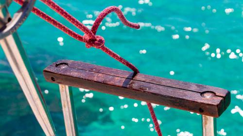 Wood and metal climbing ladder on the Equinoxe boat