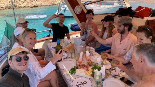 group on holiday during lunch served on board a boat in Corsica