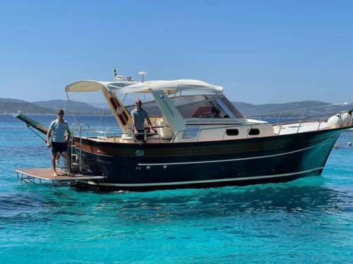 <p>Boat sails in the sea of southern Corsica</p><p><br></p>