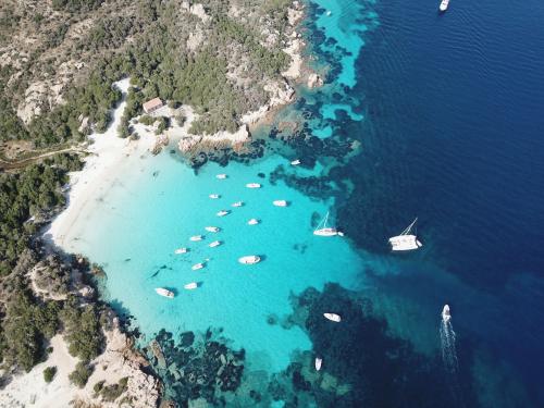 Islands, boats and crystal clear sea in the Archipelago of La Maddalena