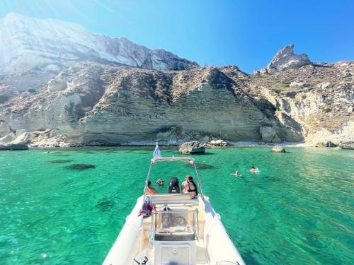 Tourists on inflatable boat in the turquoise sea of Cagliari during half day tour