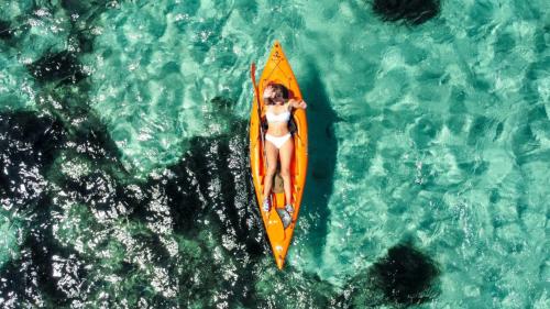 <p>Tourist kayaking in the blue sea of Golfo Aranci</p><p><br></p>
