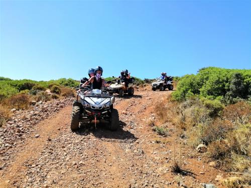 <p>Group of people in quad in the territory of Iglesias</p><p><br></p>