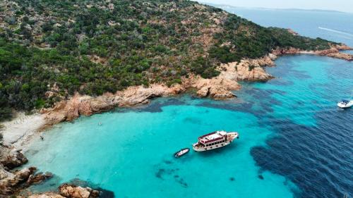 Boat off Spargi in the azure sea