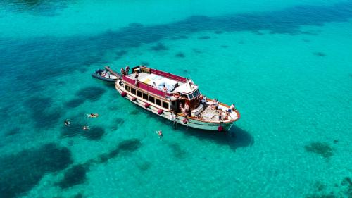 Motorship Apollo II with passengers in the waters of the La Maddalena Archipelago