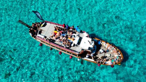 Motorship Apollo II in the azure waters of the La Maddalena Archipelago