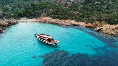 Motorship Apollo II stops at a cove in the Archipelago