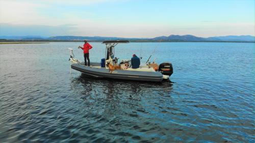 Dinghy and fishermen in south-west Sardinia