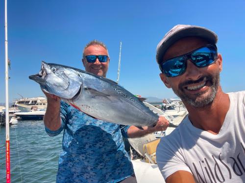 Freshly caught fish on board an inflatable boat during fishing excursion with local expert fisherman