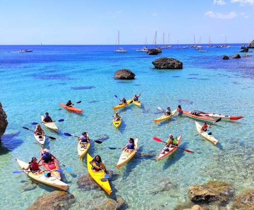 <p>Guide with kayakers in the turquoise sea of the Gulf of Cagliari</p><p><br></p>
