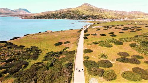 Hikers on an electric bike on the island of Asinara