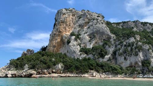 View of the rock of Cala Luna from the sea