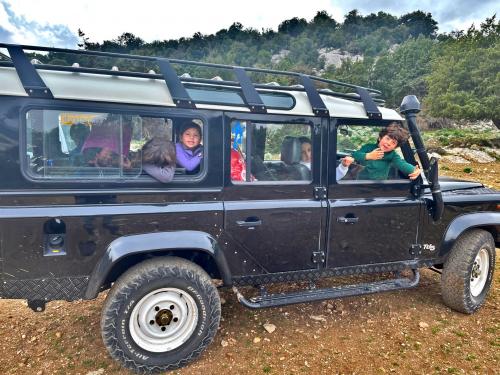 4x4 jeep in nature with kids on board