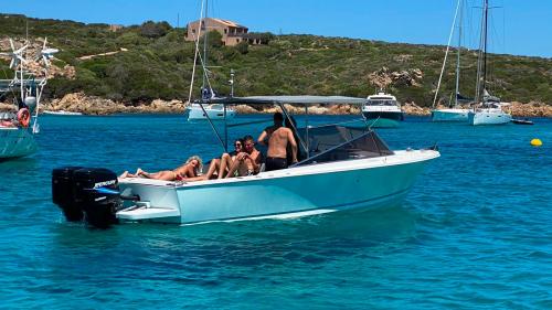 Yacht with passengers on board in the La Maddalena Archipelago