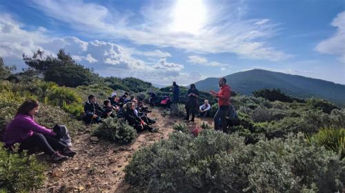 Tourists with guide during griffon vulture trek