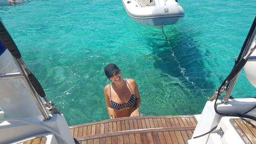 Girl in the turquoise sea of the islands of the Tavolara Marine Protected Area