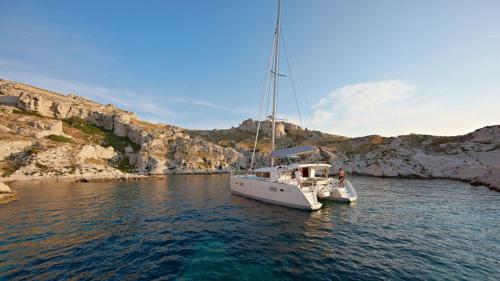 Catamaran sailing in the crystal-clear waters of the Tavolara Marine Protected Area