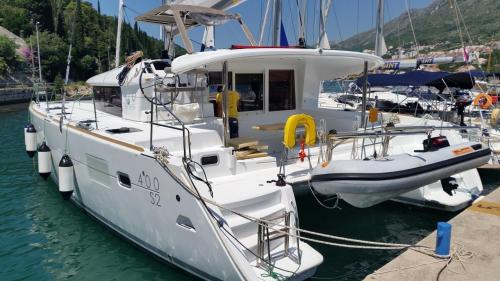Stern of catamaran moored in a harbour in Sardinia
