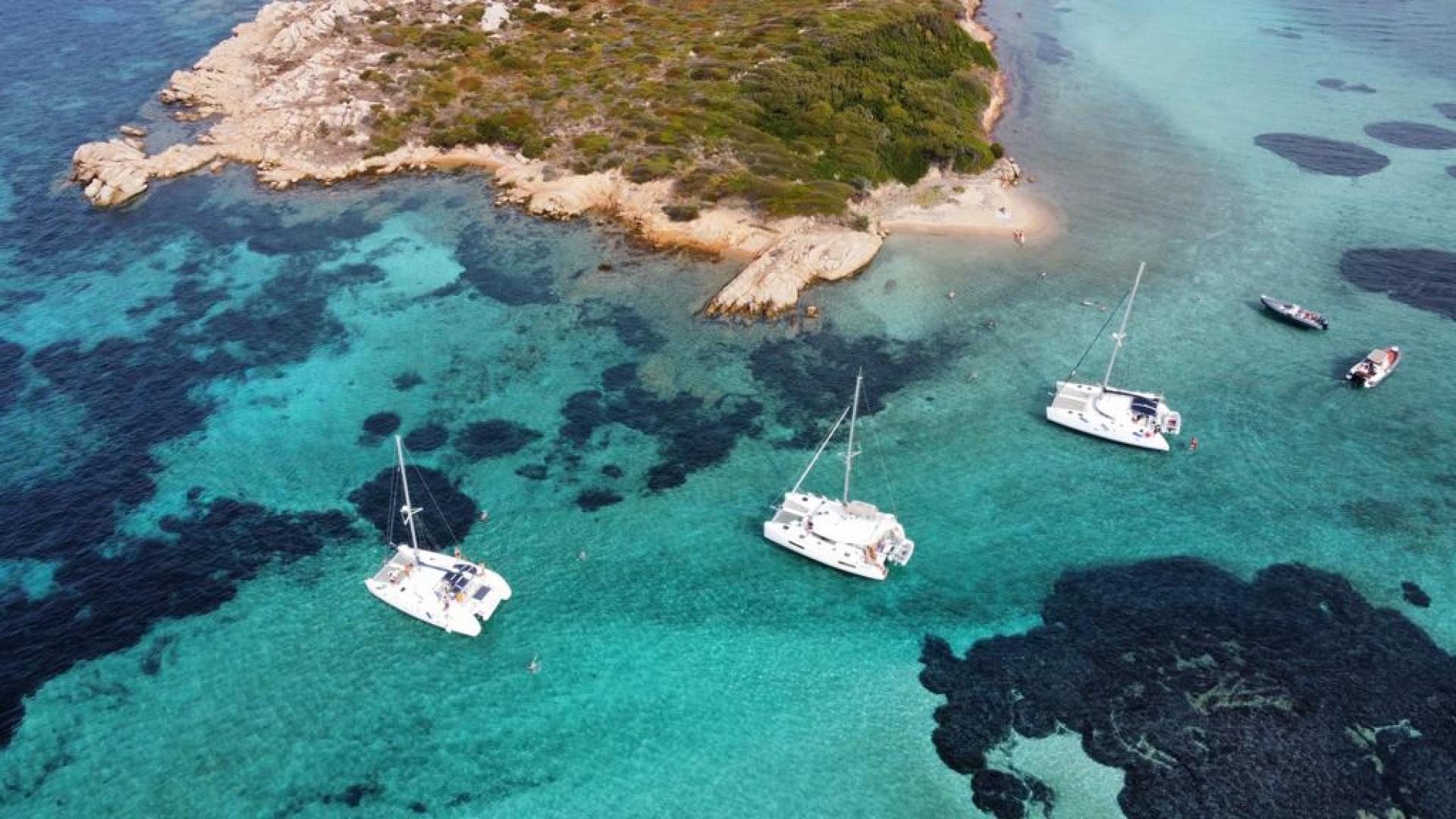 Fountaine Pajot extra luxury catamaran in the crystal clear turquoise waters of La Maddalena