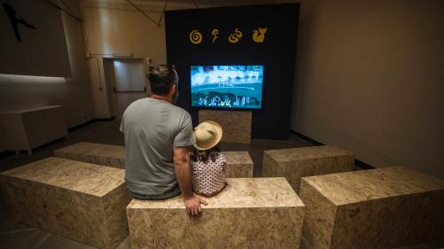 Father and daughter watch a video