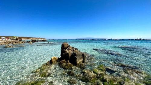 Blue water and rocks in Mal di Ventre
