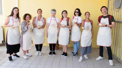 Happy participants show the panadas made