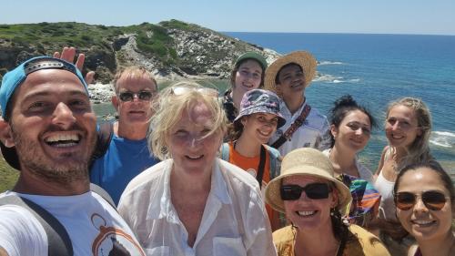 Happy hikers during coastal tour in Porto Conte Park