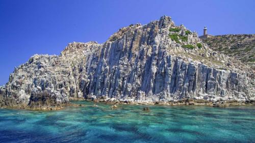 Capo Sandalo reef in Carloforte with blue water