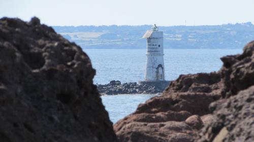 Glimpse of the Mangiabarche Lighthouse