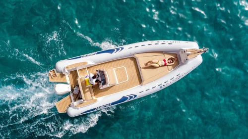 Girl sunbathing at the bow of the dinghy