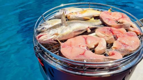 Grill with freshly caught fish