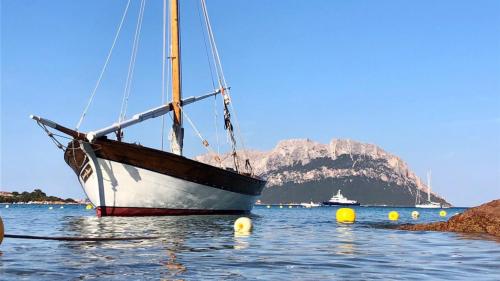 Vintage sailboat moored near the island of Tavolara