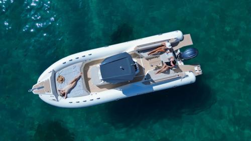 Inflatable boat  stops in the emerald water of the Gulf of Cagliari