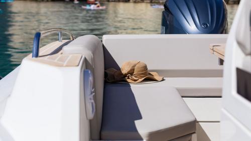 Hat resting on the aft seat of the dinghy