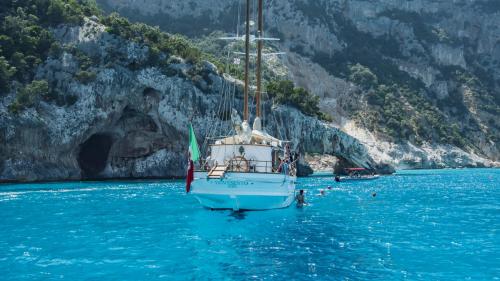 Stern of the vintage sailing ship in the Gulf of Orosei