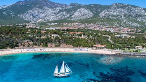 Sailing ship sails the waters of Cala Gonone in the Gulf of Orosei