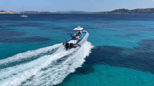 Maxi dinghy sails the south coast of Corsica