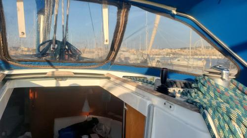 Interior of the boat and port of Alghero