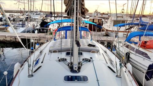 Exterior of the boat with mattress in the port of Alghero