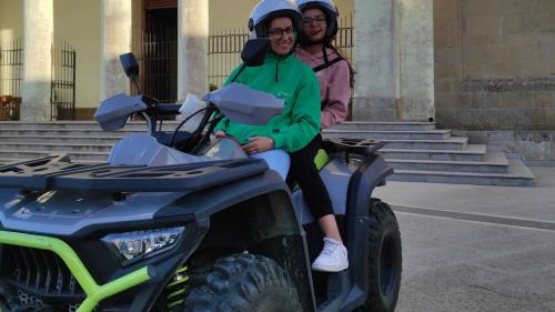 Two people on a ATV in the centre of Guasila in the province of Cagliari