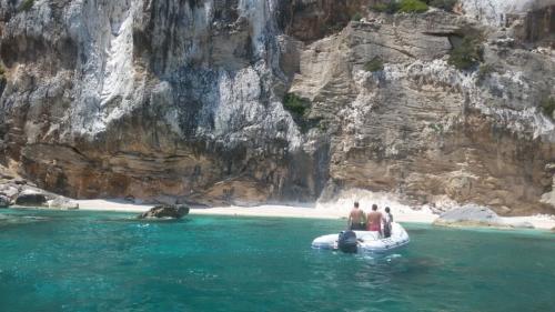 Dinghy and wind-sculpted rocks