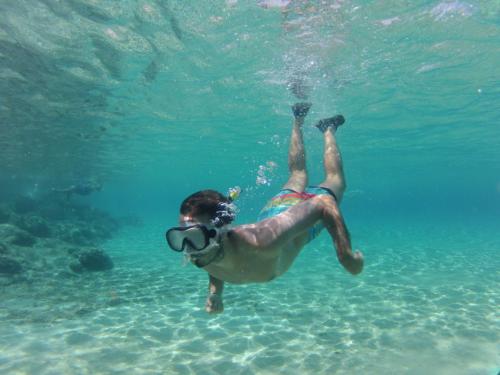 Snorkeling in the blue waters of Chia