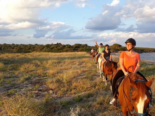 Group of hikers on horseback in Irgoli