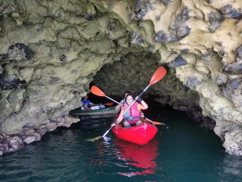 Kayak hikers come out of a hidden cave in Balai