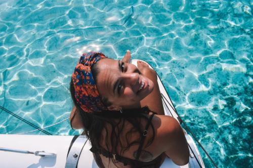 Girl on board a catamaran