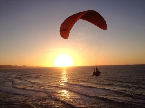 Paragliding flight at sunset