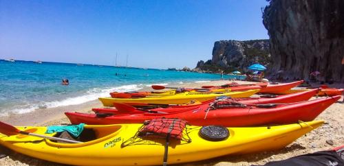 Kayaking on the beach for a guided tour in the Gulf of Orosei