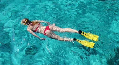 Girl snorkeling in Bosa