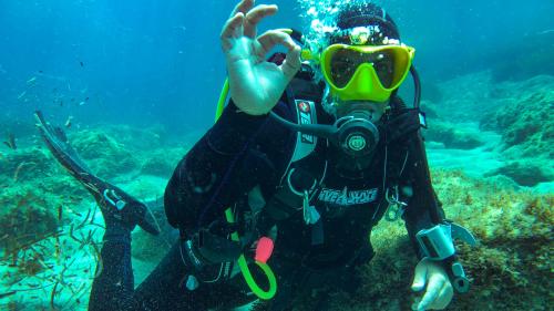 Happy diver during underwater baptism