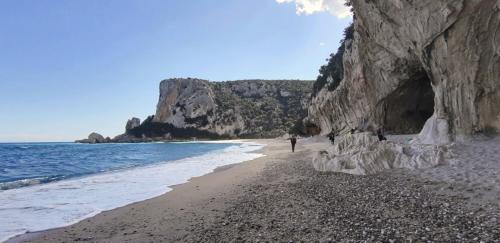 Cala Luna beach in the Gulf of Orosei and cliffs by the sea